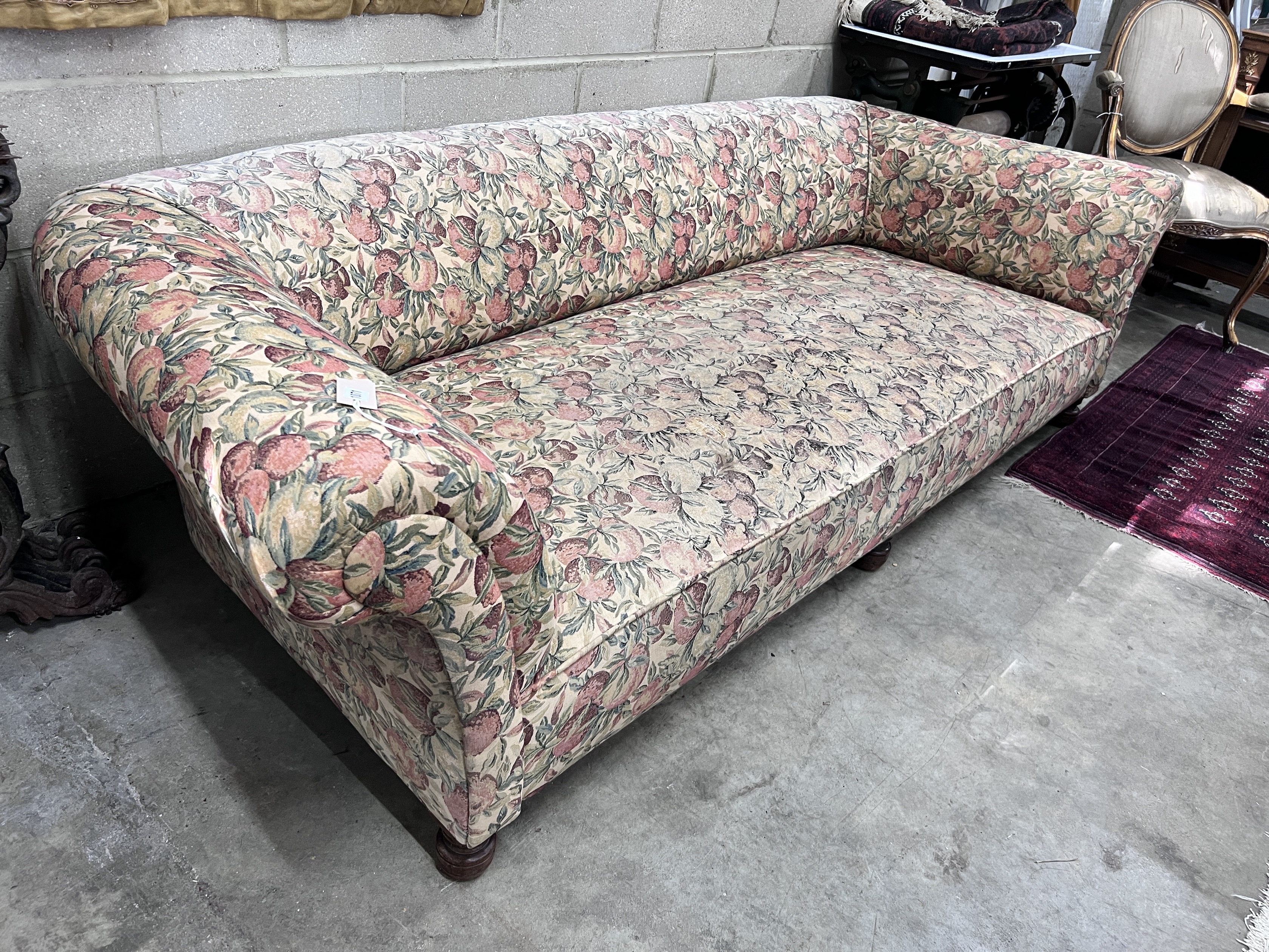 A Victorian Chesterfield settee on turned mahogany feet, length 230cm, width 100cm, height 62cm